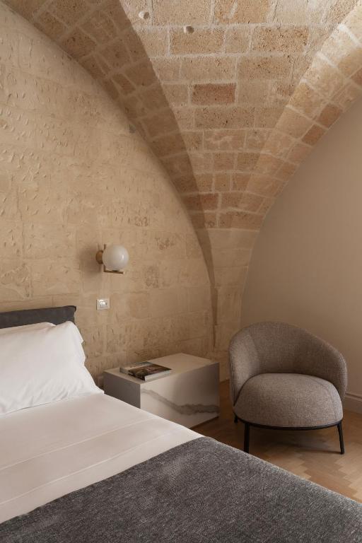 Postel nebo postele na pokoji v ubytování Palazzo Zimara Boutique Hotel