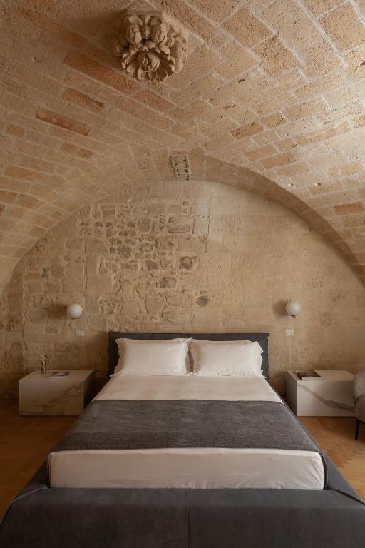 Postel nebo postele na pokoji v ubytování Palazzo Zimara Boutique Hotel
