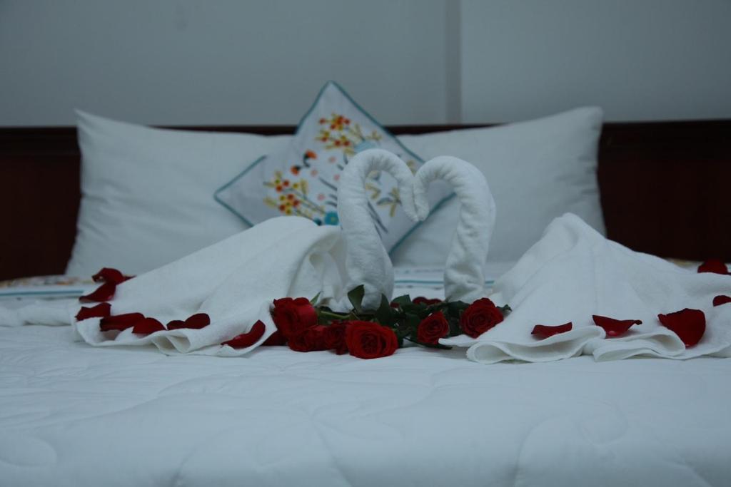Postel nebo postele na pokoji v ubytování An Bình Tài Hotel