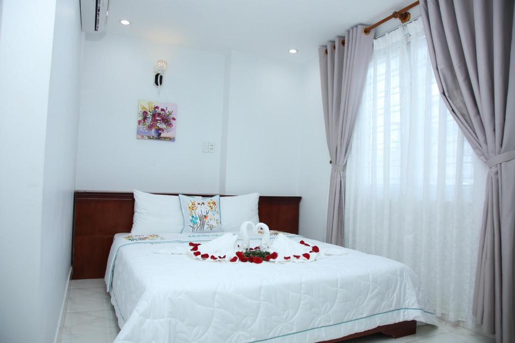 Postel nebo postele na pokoji v ubytování An Bình Tài Hotel