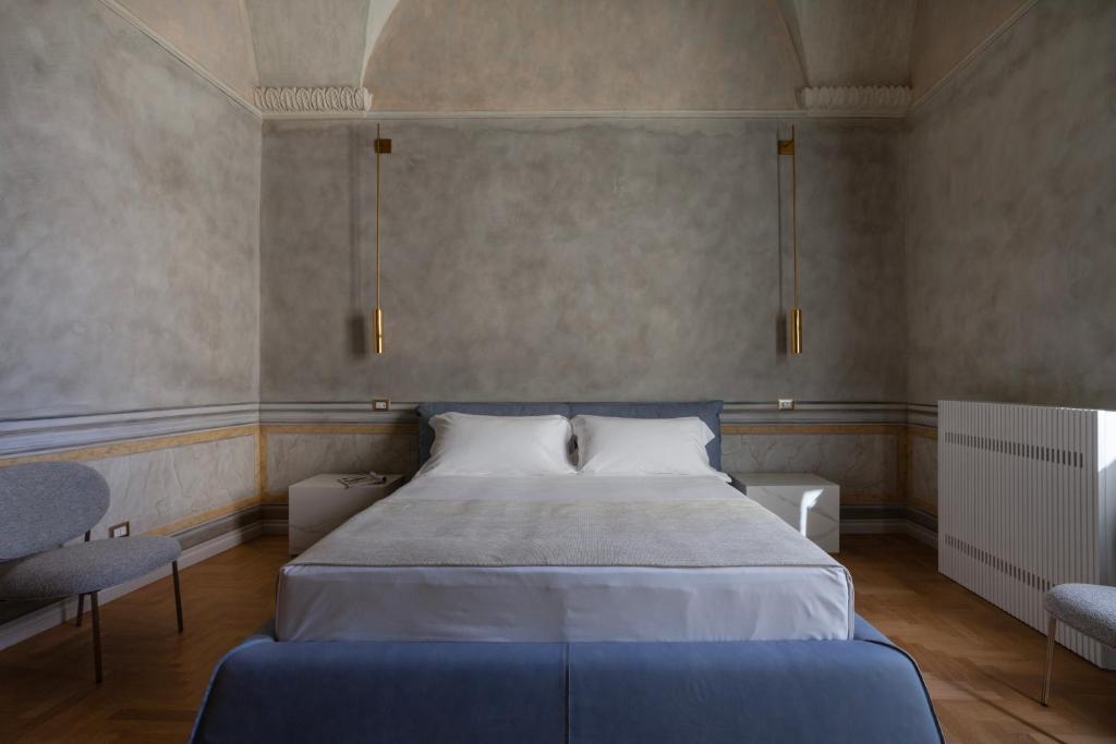 Postel nebo postele na pokoji v ubytování Palazzo Zimara Boutique Hotel
