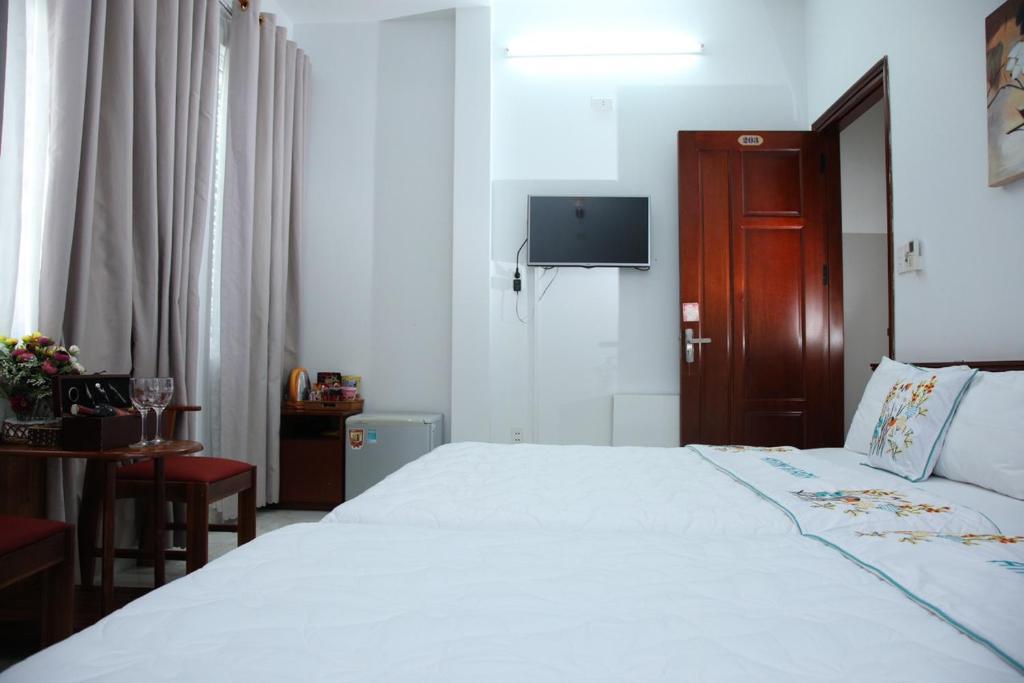 Postel nebo postele na pokoji v ubytování An Bình Tài Hotel