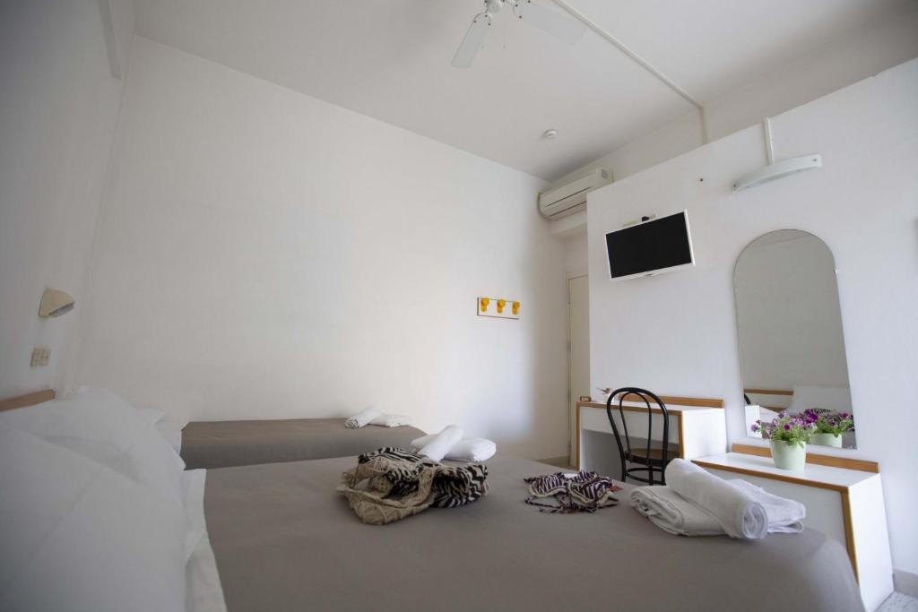 Postel nebo postele na pokoji v ubytování Hotel Eden B&B