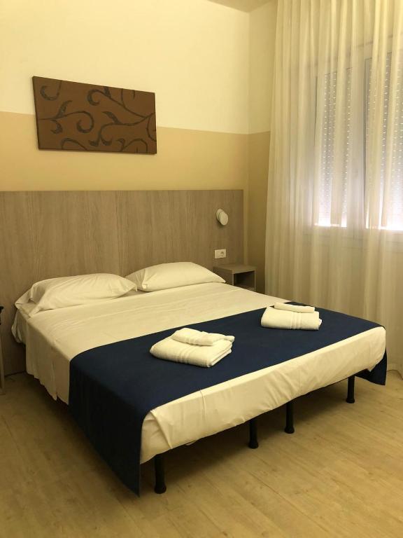 Postel nebo postele na pokoji v ubytování Hotel Mare Live