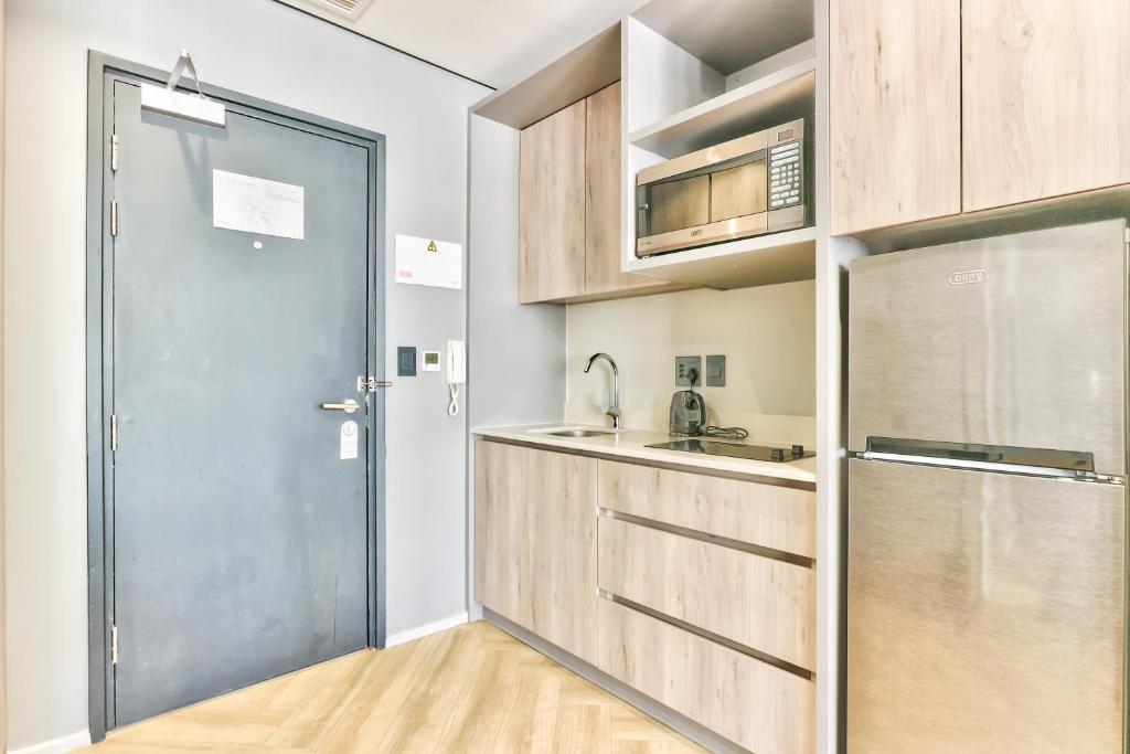 Kuchyň nebo kuchyňský kout v ubytování WINK Aparthotel One Thibault