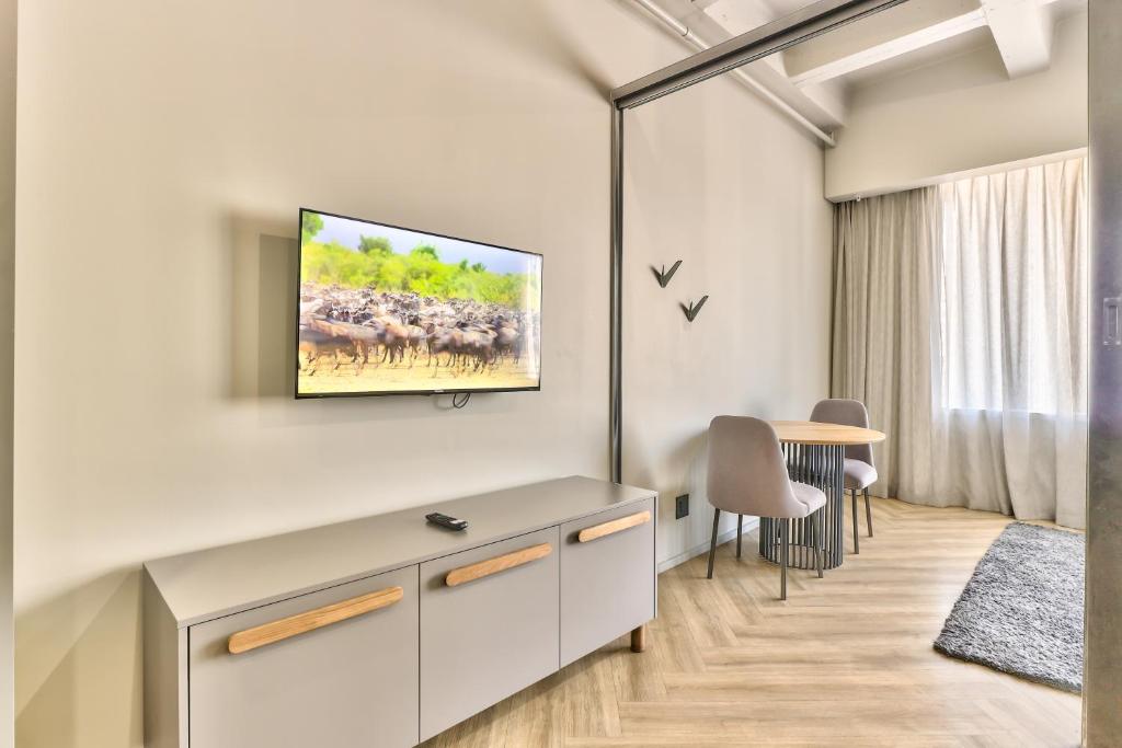 TV a/nebo společenská místnost v ubytování WINK Aparthotel One Thibault