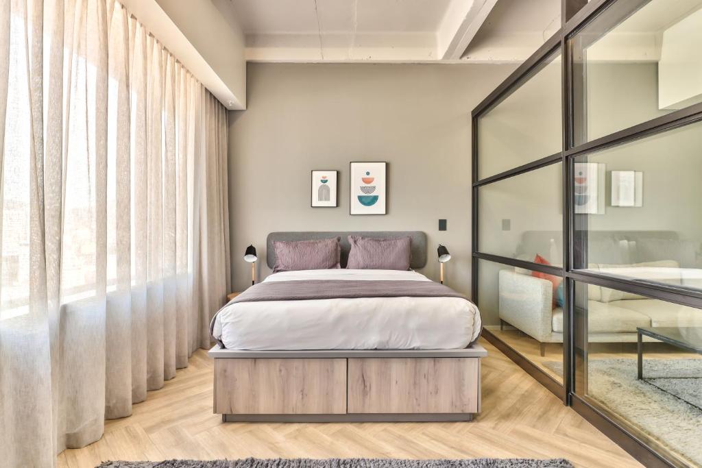 Postel nebo postele na pokoji v ubytování WINK Aparthotel One Thibault