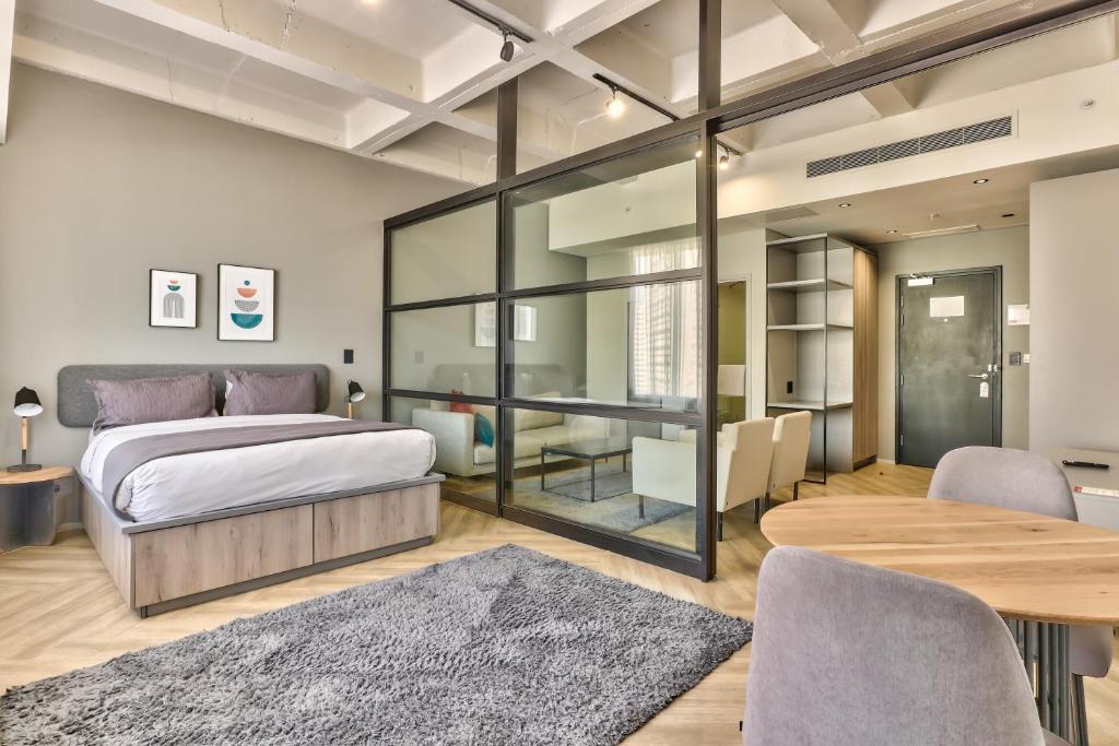 Postel nebo postele na pokoji v ubytování WINK Aparthotel One Thibault
