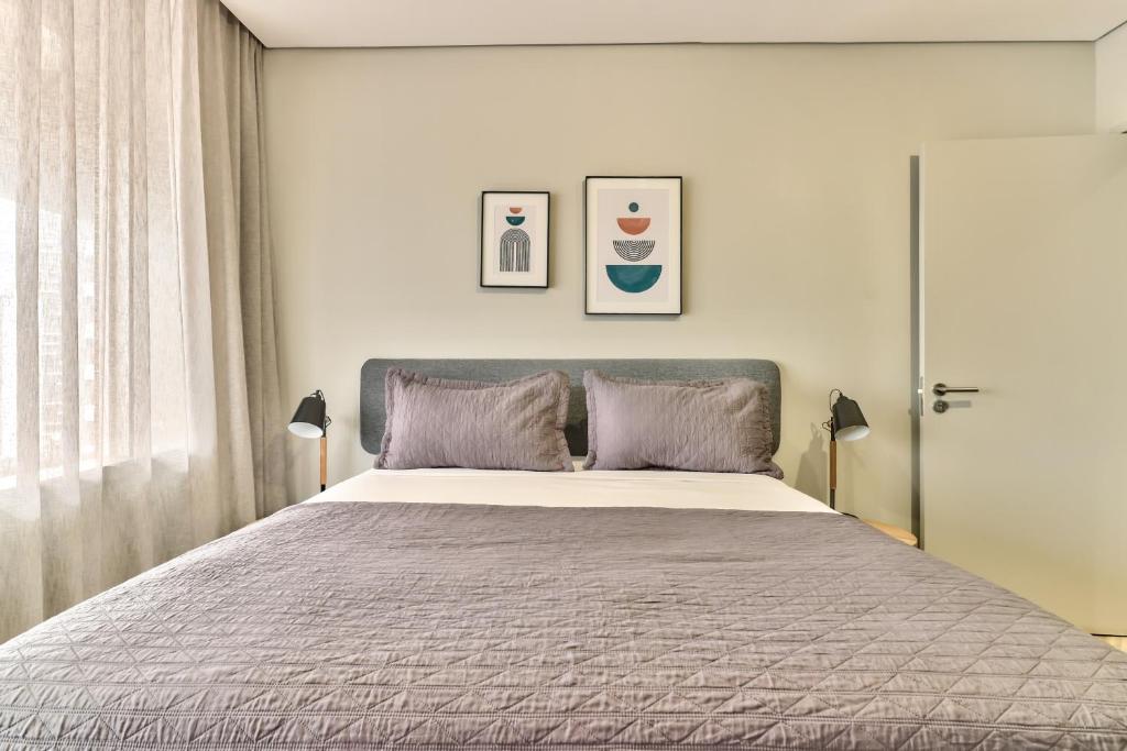 Postel nebo postele na pokoji v ubytování WINK Aparthotel One Thibault