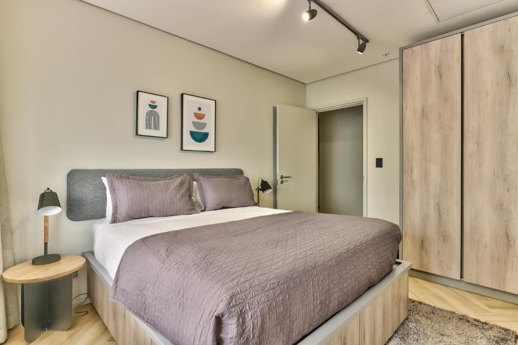 Postel nebo postele na pokoji v ubytování WINK Aparthotel One Thibault