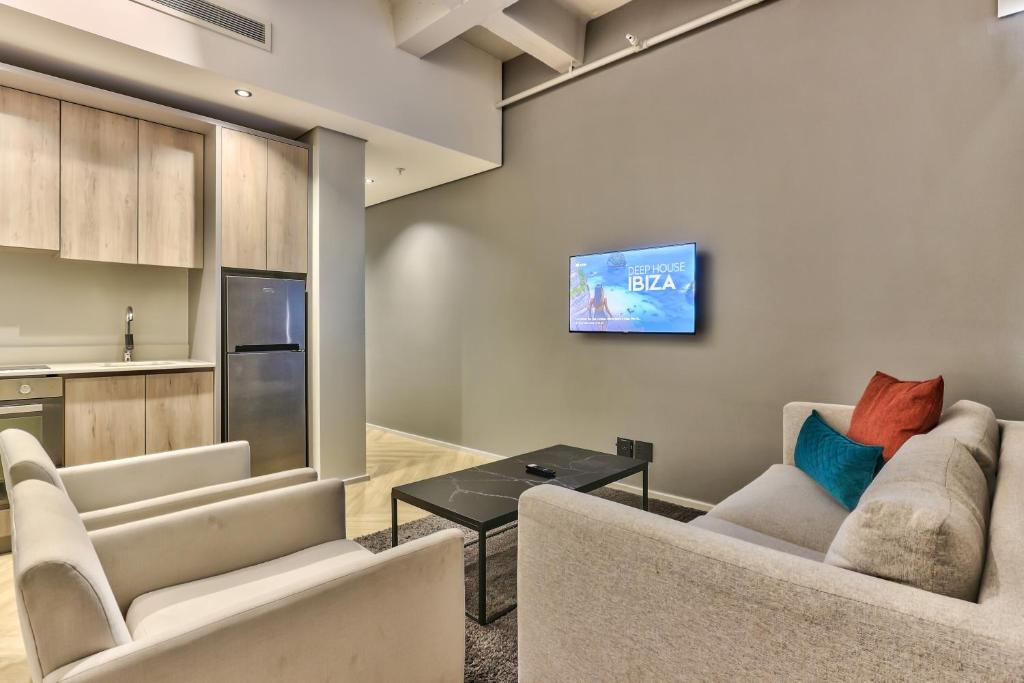 Kuchyň nebo kuchyňský kout v ubytování WINK Aparthotel One Thibault