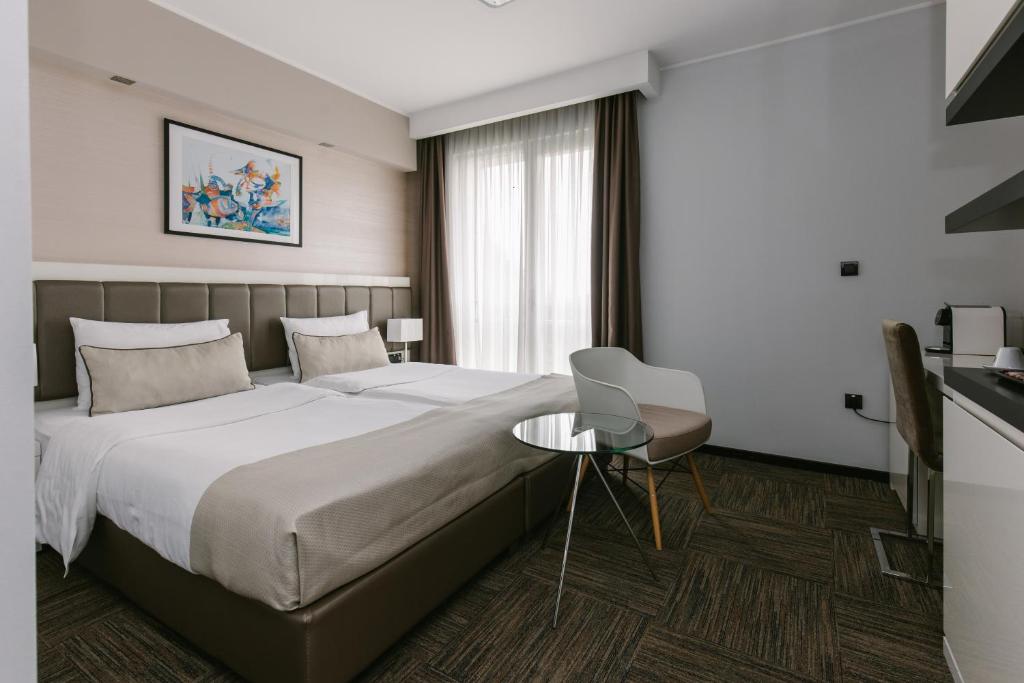 Postel nebo postele na pokoji v ubytování Hotel Heritage