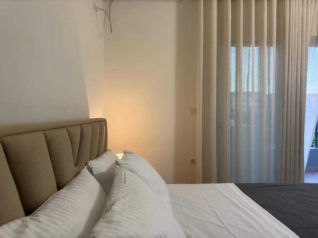 Postel nebo postele na pokoji v ubytování Angelo Agapi Rooms Vlore