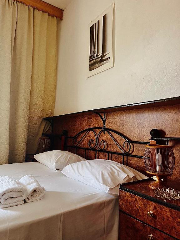 Postel nebo postele na pokoji v ubytování Hotel Holiday