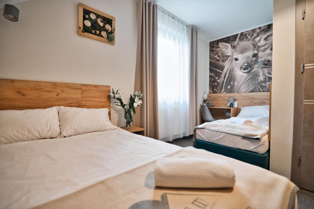 Posteľ alebo postele v izbe v ubytovaní Villa Natura Zator Przeciszów