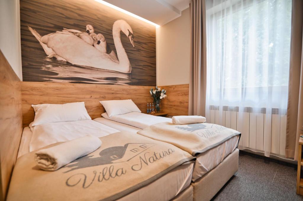 Posteľ alebo postele v izbe v ubytovaní Villa Natura Zator Przeciszów