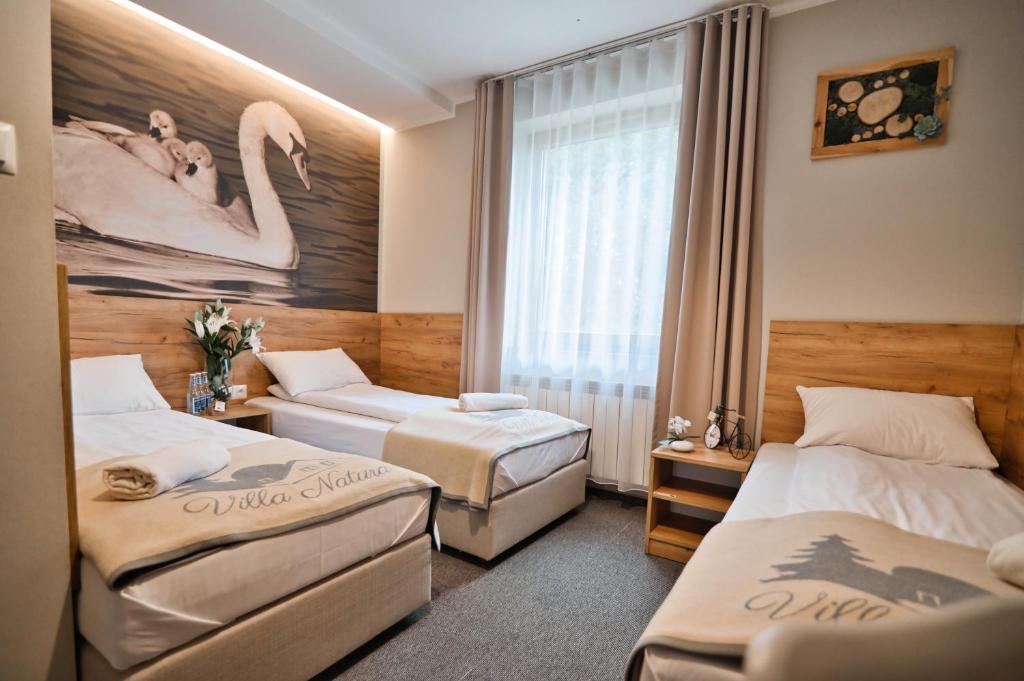 Posteľ alebo postele v izbe v ubytovaní Villa Natura Zator Przeciszów