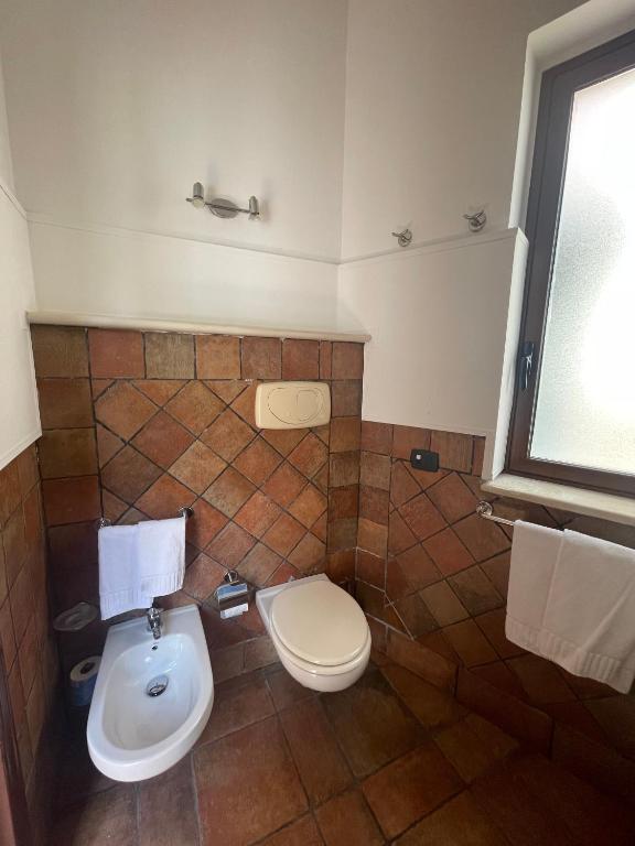 Koupelna v ubytování Hotel Capomulini 3 Stelle