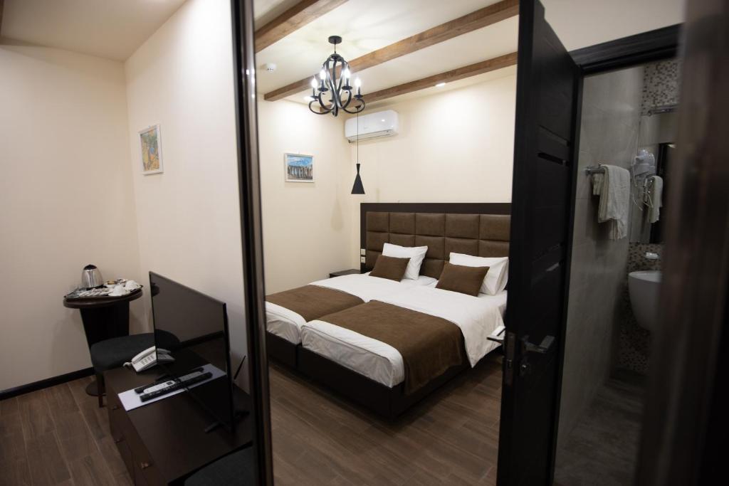 Postel nebo postele na pokoji v ubytování Boutique Living Hotel