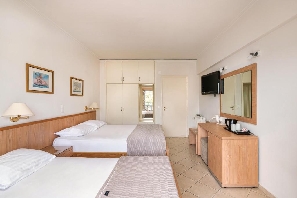 Postel nebo postele na pokoji v ubytování Danae Hotel