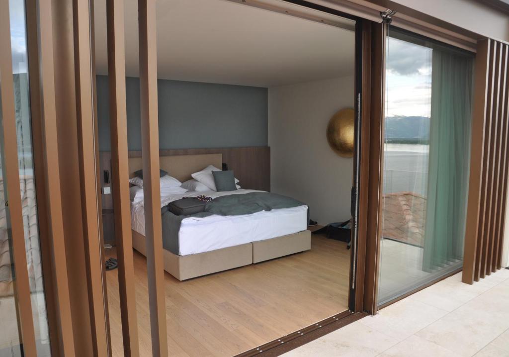 Postel nebo postele na pokoji v ubytování Boutique Hotel La Rocca