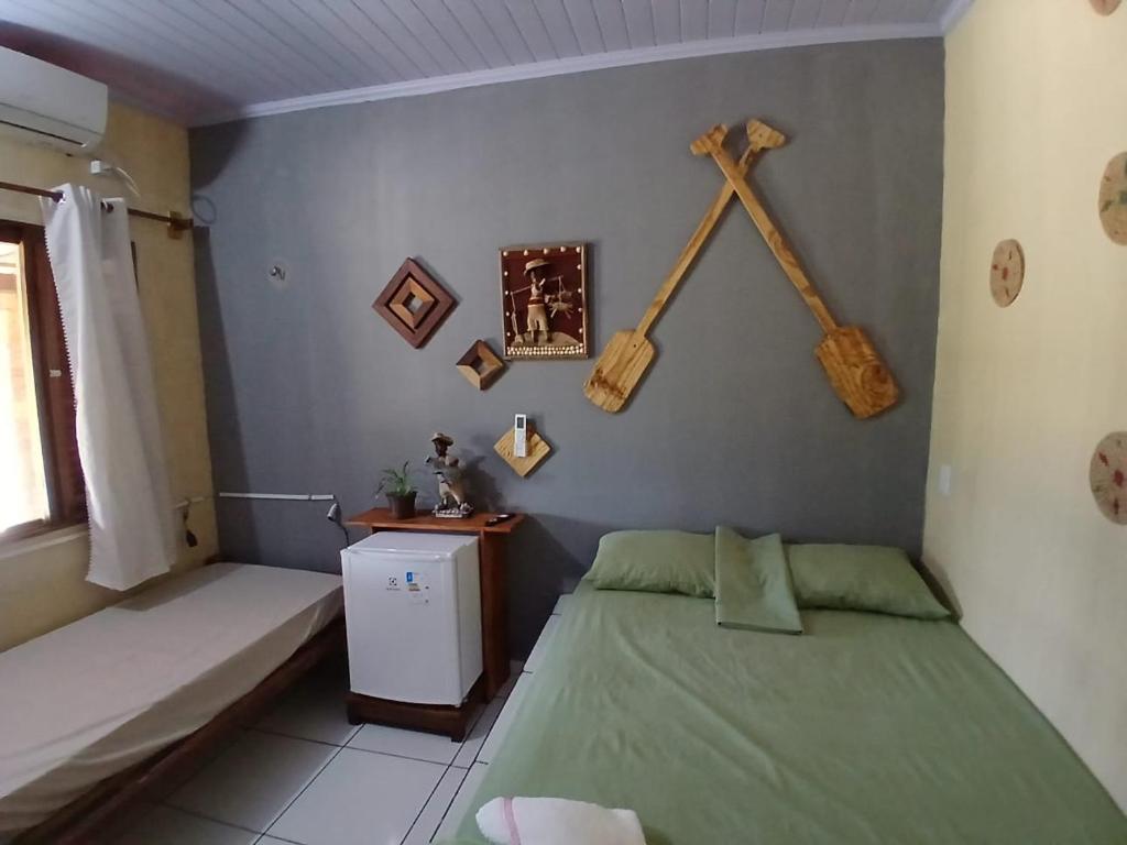 Postel nebo postele na pokoji v ubytování Pousada rancho sol nascente