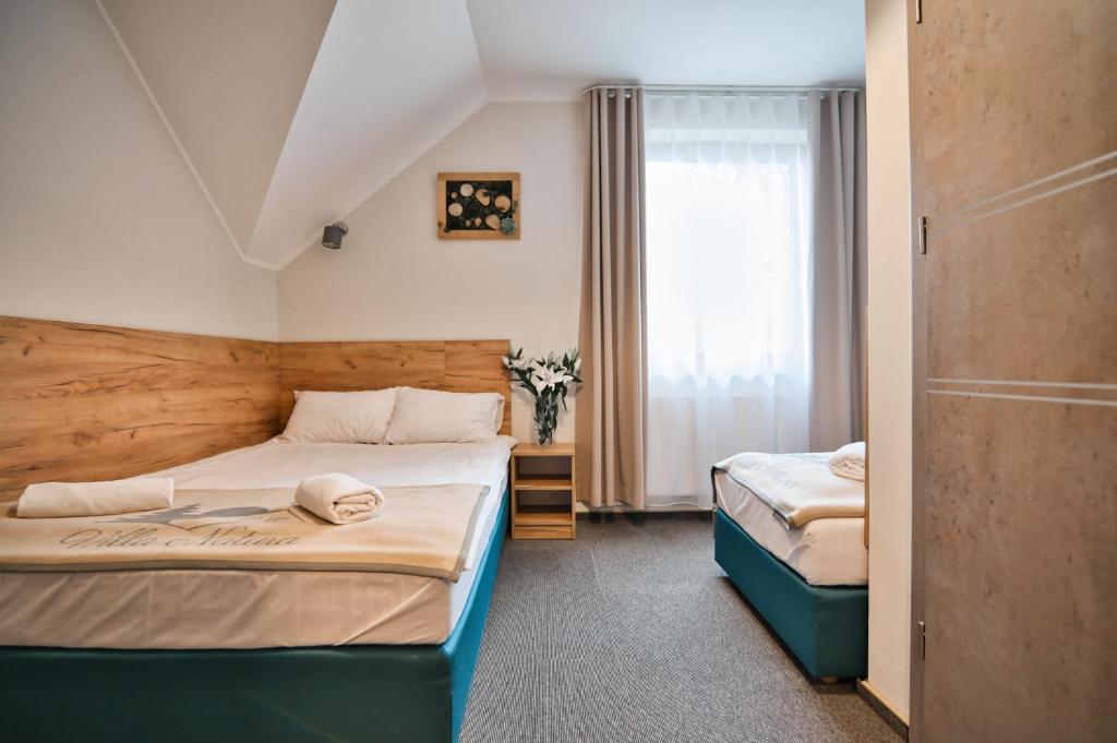 Posteľ alebo postele v izbe v ubytovaní Villa Natura Zator Przeciszów