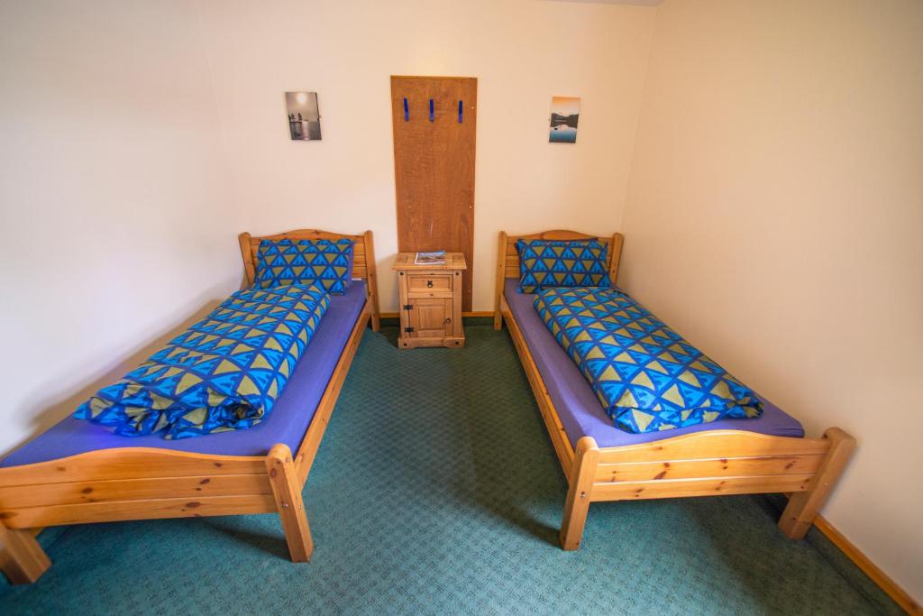 Postel nebo postele na pokoji v ubytování Aviemore Youth Hostel