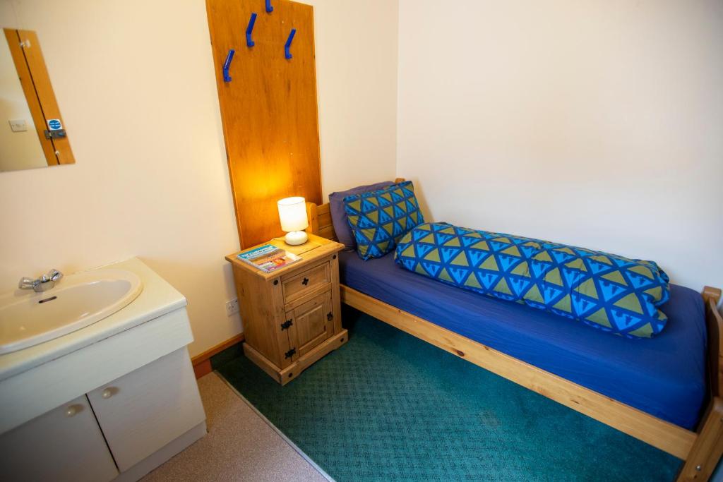 Postel nebo postele na pokoji v ubytování Aviemore Youth Hostel