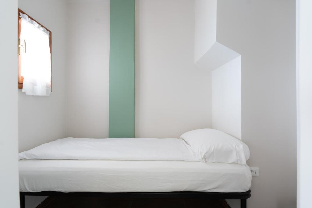 Postel nebo postele na pokoji v ubytování Hotel Forbisicle