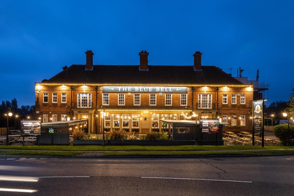 a large building with lights on it at night at Blue Bell Lodge Hotel in Middlesbrough