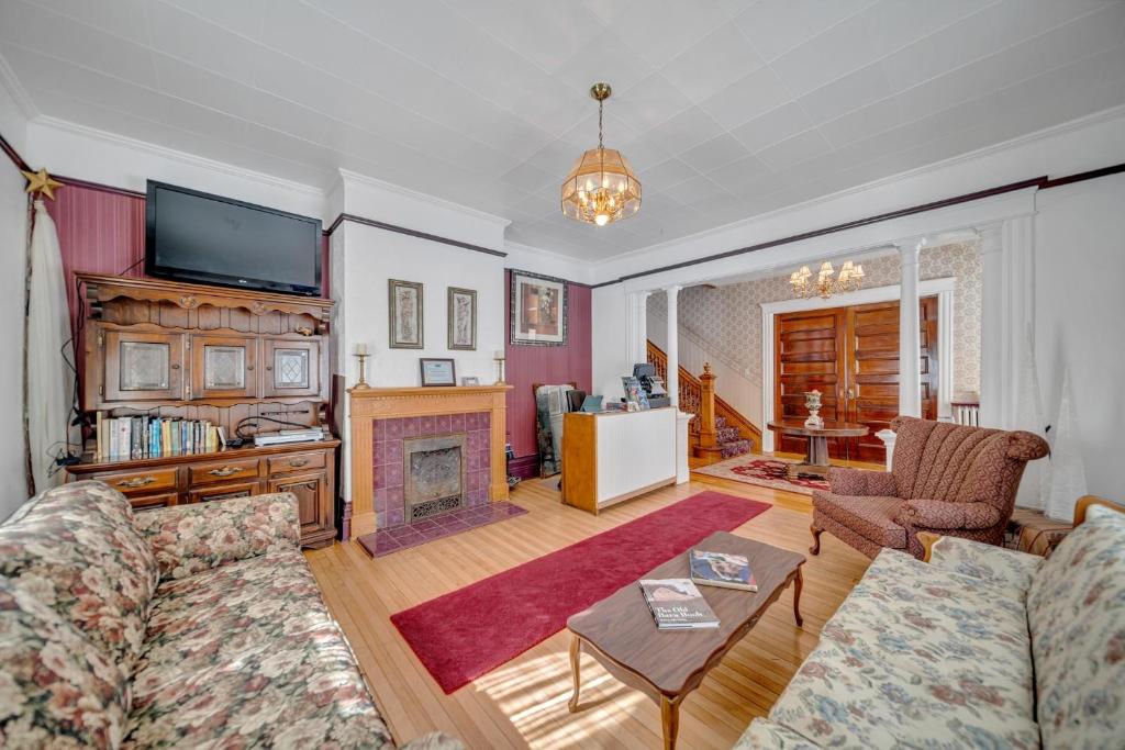 a living room with a couch and a fireplace at Marmora and Lake Inn Superior Apartment- Sleeps 13 guests in Marmora