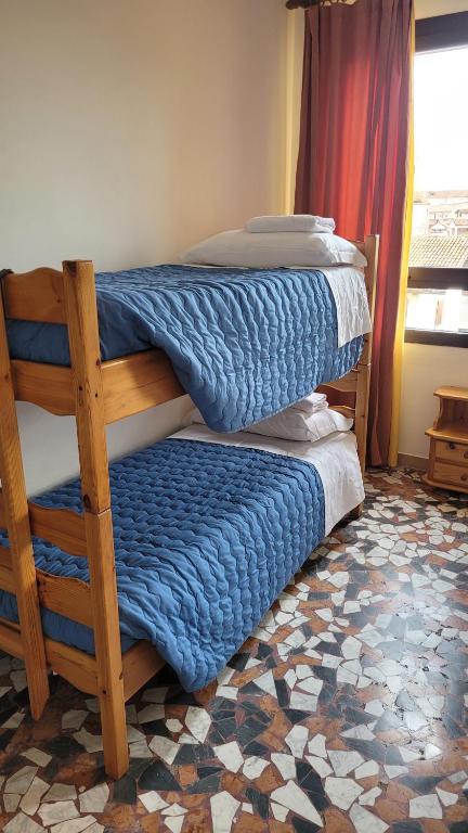 Postel nebo postele na pokoji v ubytování Ostello di Vicenza