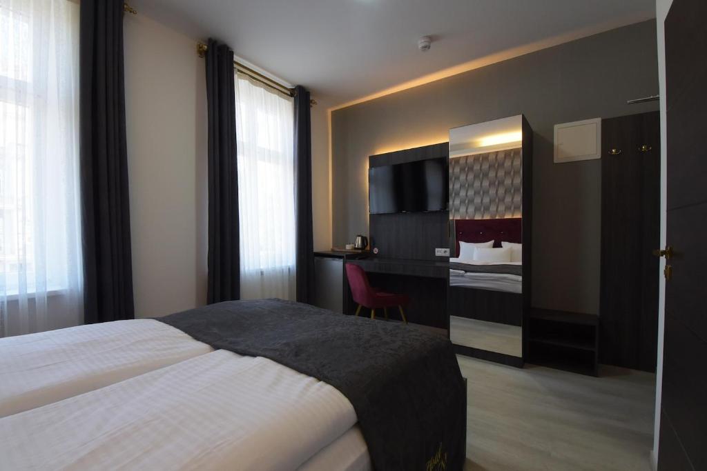Postel nebo postele na pokoji v ubytování Hotel Grand Inn Berlin - Weißensee