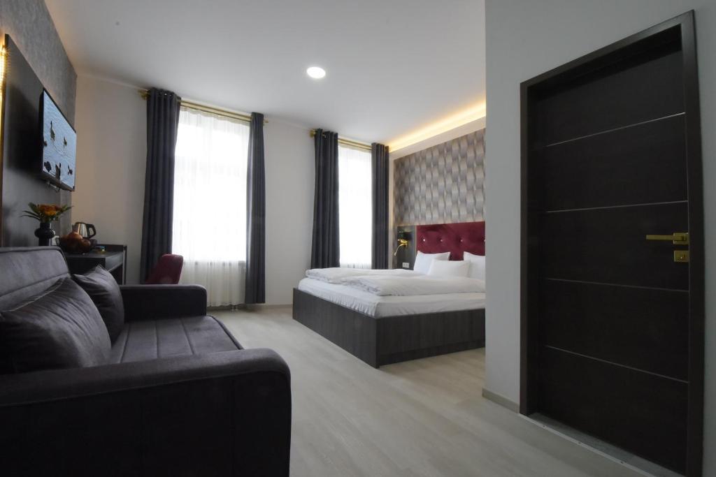 Postel nebo postele na pokoji v ubytování Hotel Grand Inn Berlin - Weißensee