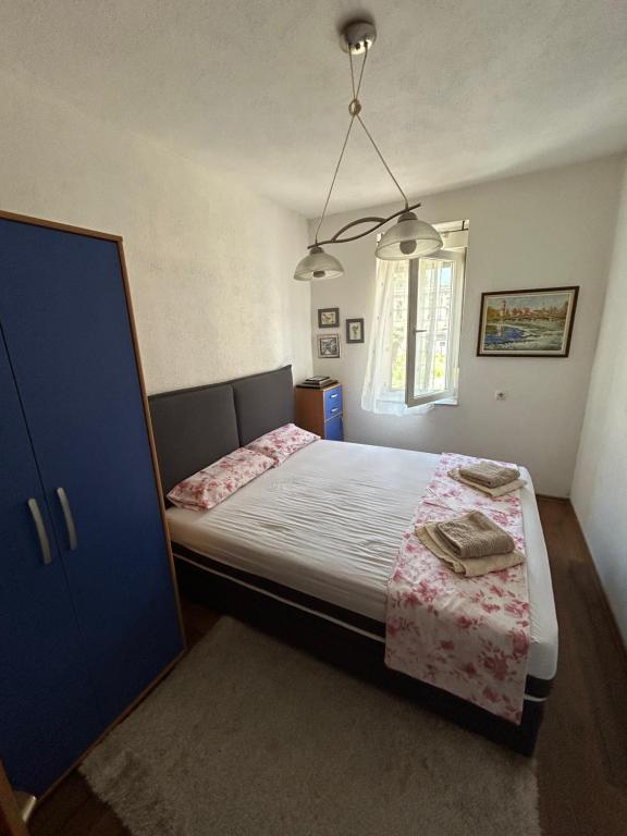 Postel nebo postele na pokoji v ubytování Apartman LAV