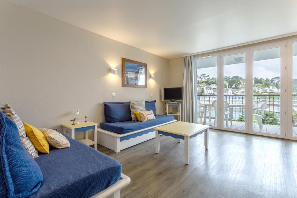 TV a/nebo společenská místnost v ubytování Appartement vue mer sur plage