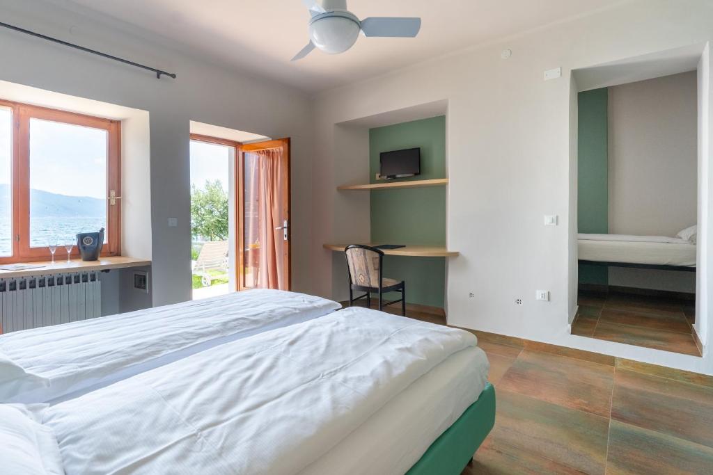 Postel nebo postele na pokoji v ubytování Hotel Forbisicle