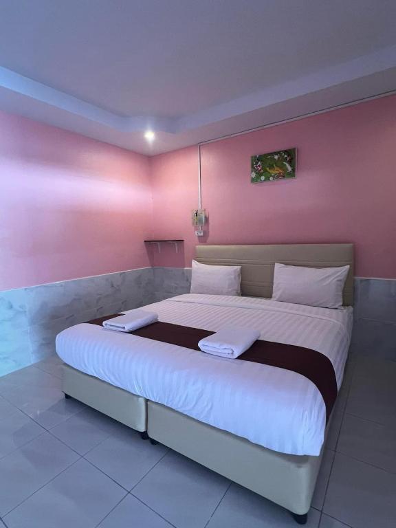 Postel nebo postele na pokoji v ubytování คลิ๊กรีสอร์ท (Click Resort)