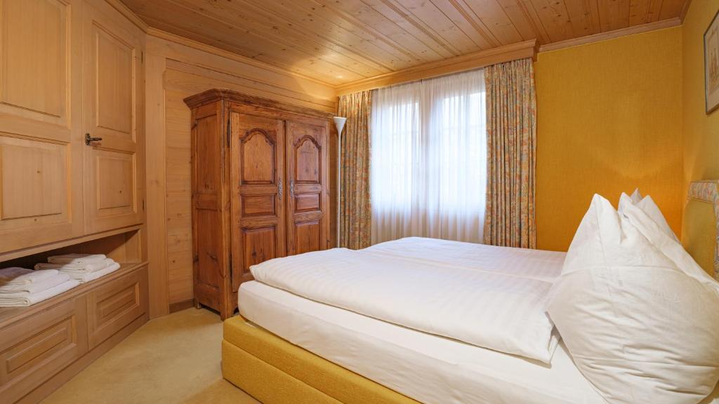 Postel nebo postele na pokoji v ubytování Chalet Kisseye by Zermatt Premium Apartments