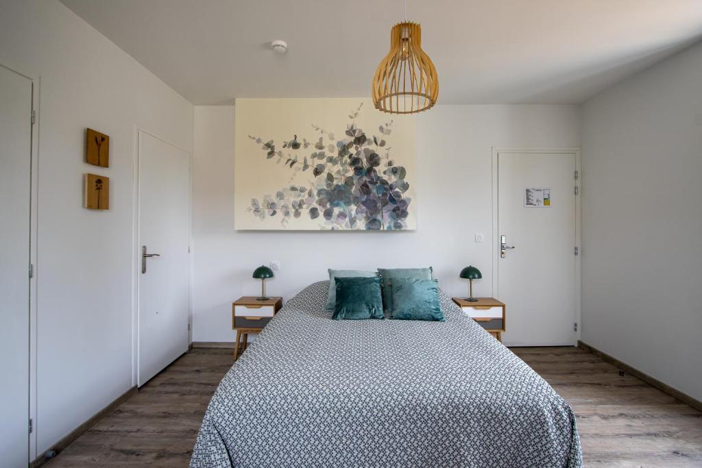 Postel nebo postele na pokoji v ubytování Auberge du Molveau