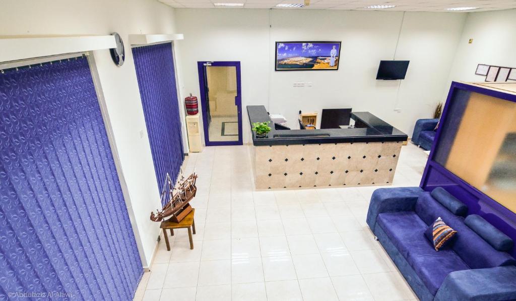 TV a/nebo společenská místnost v ubytování Al Jumhour Hotel Apartments