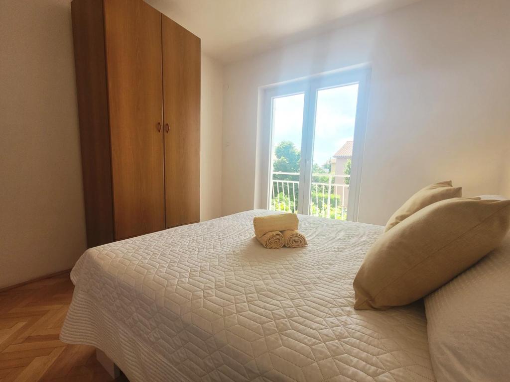 Postel nebo postele na pokoji v ubytování Apartments Blazevic