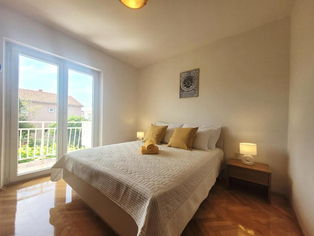 Postel nebo postele na pokoji v ubytování Apartments Blazevic