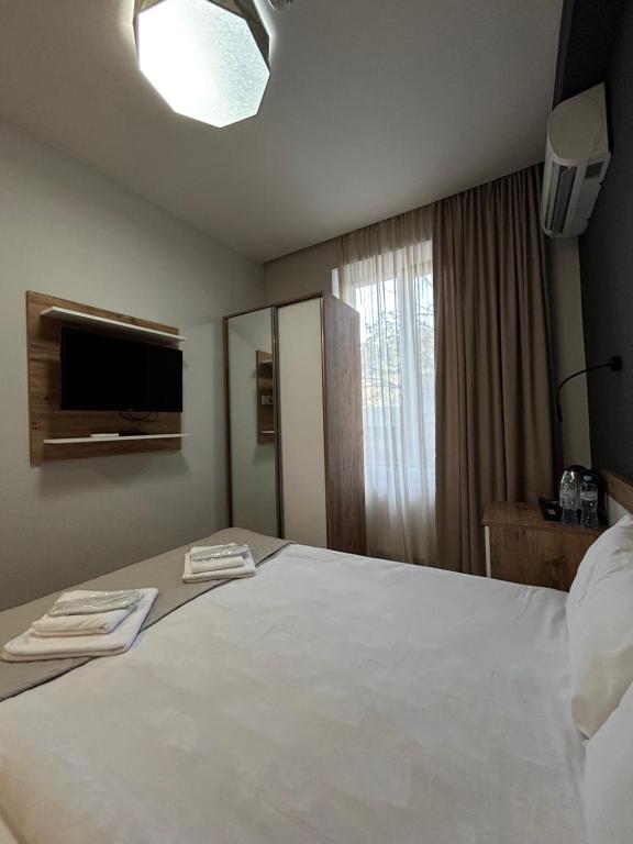 Postel nebo postele na pokoji v ubytování 10 KEYS Boutique Hotel