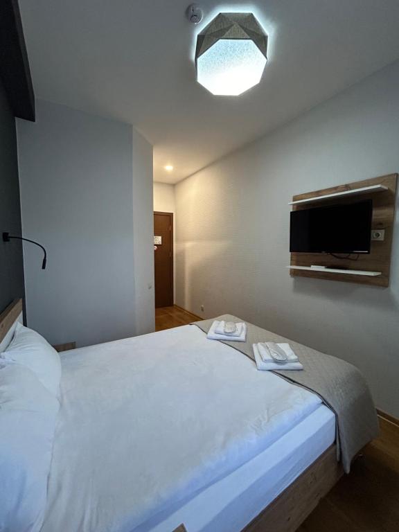 Postel nebo postele na pokoji v ubytování 10 KEYS Boutique Hotel