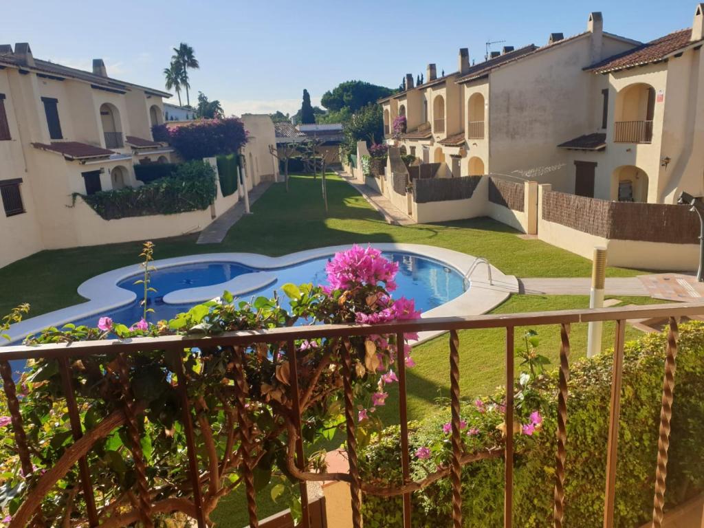 a view from the balcony of a house with a swimming pool at Lluna Beach Bará in Roda de Bará