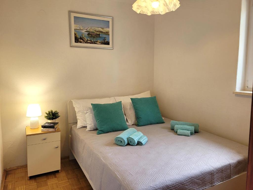 Postel nebo postele na pokoji v ubytování Apartments Blazevic