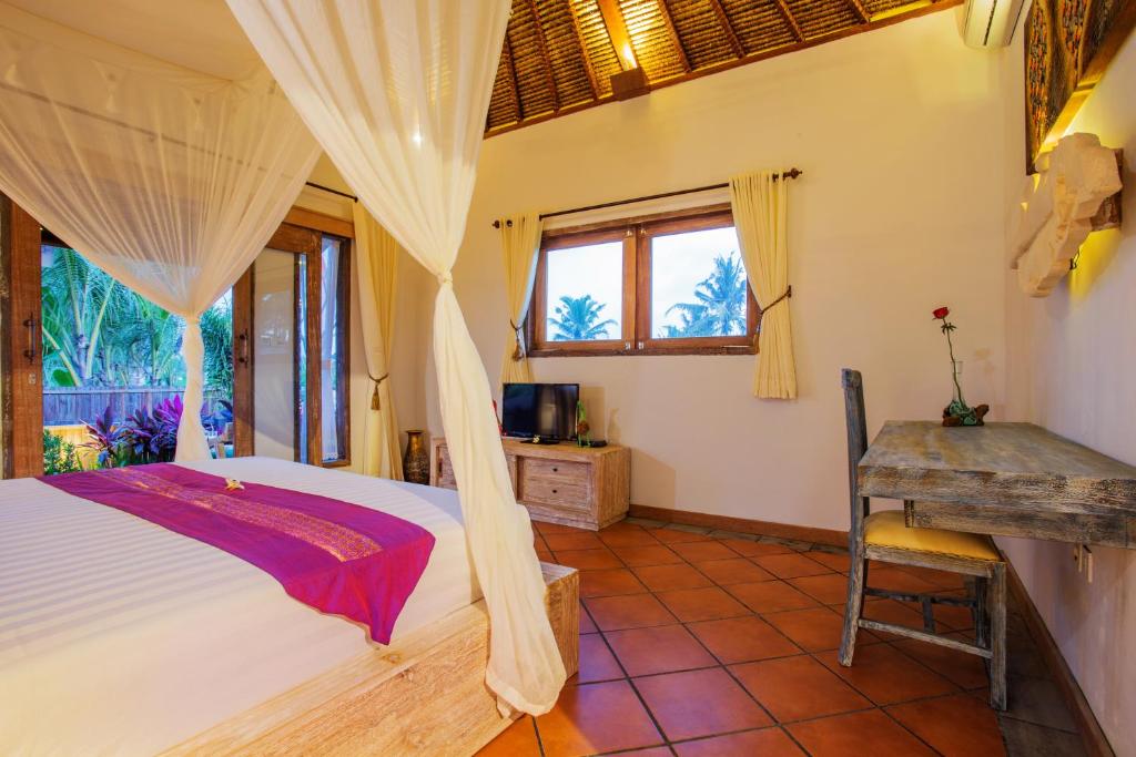 Postel nebo postele na pokoji v ubytování Ubud Luwih Nature Retreat