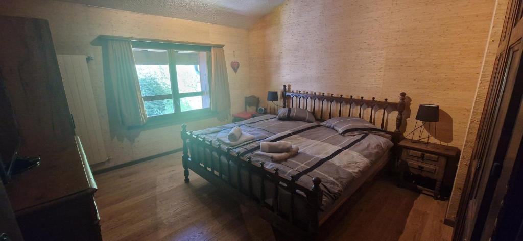Postel nebo postele na pokoji v ubytování Appartement, vue sur le lac